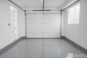 Los Angeles house for rent - A spacious room with a white door and a window on the right side.