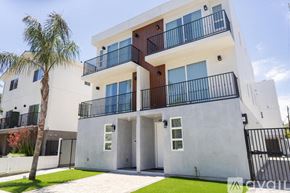 Los Angeles house for rent - A modern two-story building with balconies and doors.