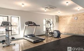 Chicago apartment for rent - A gym with treadmills, elliptical machines, and a stationary bike.