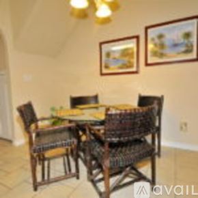 Corpus Christi condo for rent - A dining room with a table and chairs.