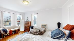 Somerville apartment for rent - A bedroom with a bed, dresser, and window.