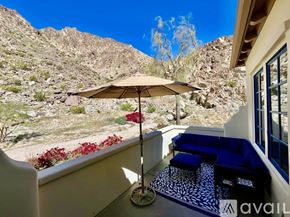 La Quinta house for rent - A dining room with a wooden table and chairs.
