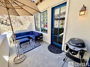 La Quinta house for rent - A kitchen with brown cabinets and granite countertops.