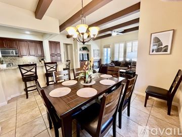 La Quinta house for rent - A living room with a brown couch and a rug.