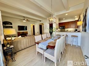 La Quinta townhouse for rent - A dining room with a wooden table and chairs.