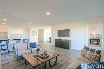 Bullhead City house for rent - A living room with a wooden coffee table and a television.