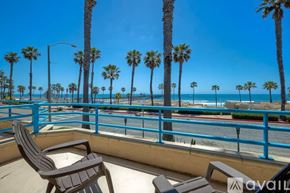 Oceanside apartment for rent - A sunny day at the beach with palm trees and benches.