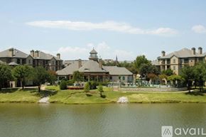 Irving apartment for rent - A large house with a pond in front of it.
