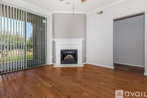 Irving apartment for rent - A room with a fireplace and sliding glass doors.