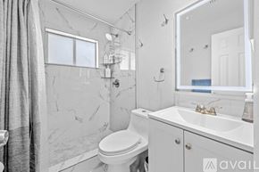 Fort Lauderdale apartment for rent - A bedroom with two beds and a ceiling fan.