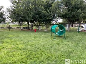 Fort Worth apartment for rent - A playground with a green slide and a red fire hydrant.