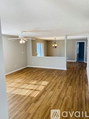 Greenville condo for rent - A living room with a fireplace and wood flooring.