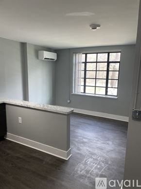 Highland Park apartment for rent - A room with a window and a marble counter.