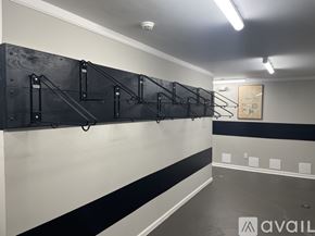 Highland Park apartment for rent - A gym with a row of pull up bars on the wall.