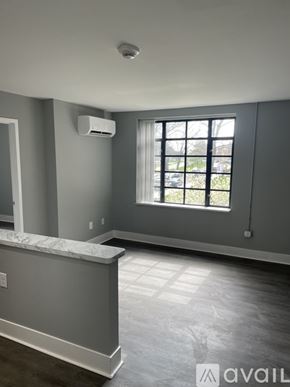 Highland Park apartment for rent - A room with a window and a marble counter.
