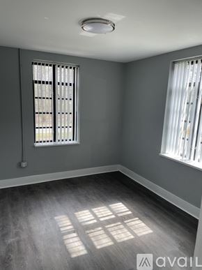 Highland Park apartment for rent - A room with grey walls and a window with blinds.