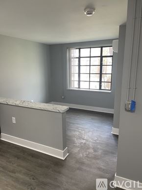 Highland Park apartment for rent - A room with a window and a marble ledge.