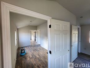 Stilwell house for rent - A room with a white door and a blue toy car on the floor.