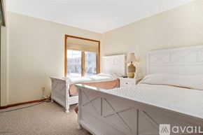 Wildwood condo for rent - A bedroom with two beds and a window.
