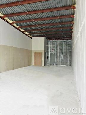 Edinburg apartment for rent - A large empty room with a metal roof and white walls.