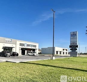 Edinburg apartment for rent - A car wash business named Laya Wash is located in a parking lot.