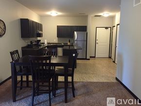 Mankato apartment for rent - A kitchen with a dining table and chairs.