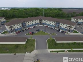 Mankato apartment for rent - A parking lot in front of a building with the word AVAIL on it.