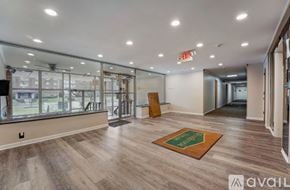 Ewing Township apartment for rent - A room with wooden floors and a green mat on the floor.