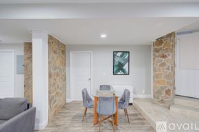 Washington apartment for rent - A dining area with a table and chairs is shown.