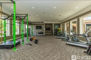 Plano apartment for rent - A gym with a variety of equipment including treadmills, weights, and a bench press.