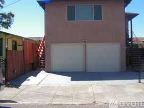 Oakland house for rent - A two-car garage is attached to a house.