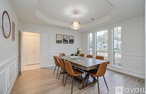 Cypress house for rent - A dining room with a table and chairs.