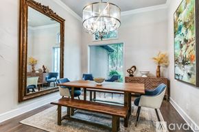 Lakewood Village house for rent - A dining room with a wooden table and blue chairs.