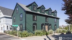 New Castle apartment for rent - A green building with the name Walbach 4 on the front.