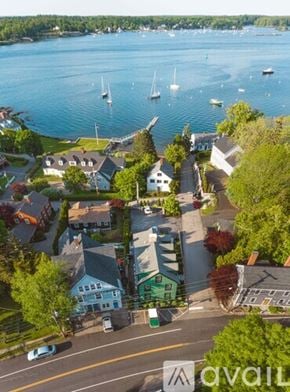 New Castle apartment for rent - A bird's eye view of a small town with a body of water and boats.
