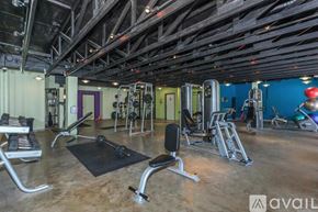 Irving apartment for rent - A gym with a variety of equipment including weights and cardio machines.
