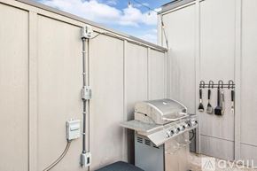 Dallas townhouse for rent - A grill is installed on the side of a building.