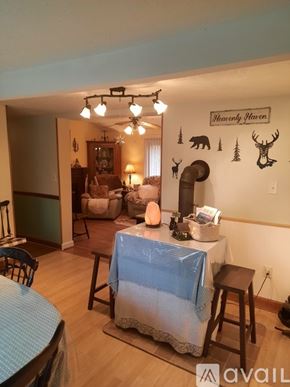 Warrensville house for rent - A dining room with a table set for a meal.