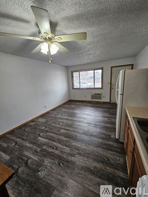 La Crosse apartment for rent - A bathroom with a toilet, sink, mirror and lights.