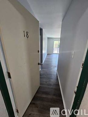 Chester apartment for rent - A hallway with the number 18 on the door.