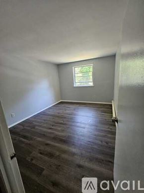 Chester apartment for rent - A room with wooden flooring and a window.