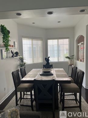 Inglewood condo for rent - A dining room with a table set for four.