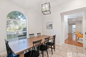 North Richland Hills house for rent - A dining room with a wooden table and chairs.