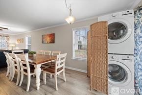Winston-Salem apartment for rent - A dining room with a wooden table and chairs.