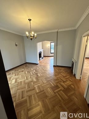 San Francisco apartment for rent - A room with wooden flooring and a chandelier.