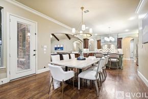 Rowlett house for rent - A dining room with a white table and chairs.