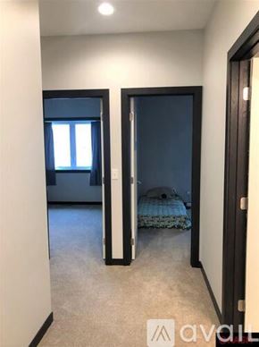 North Mankato townhouse for rent - A bedroom with a bed and a window.