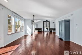 Westcliffe house for rent - A bedroom with a large bed, a dresser, and a ceiling fan.