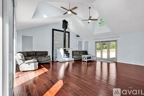 Westcliffe house for rent - A kitchen with dark blue cabinets and a white fridge.