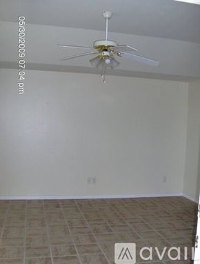 College Station townhouse for rent - A room with a ceiling fan and tile flooring.